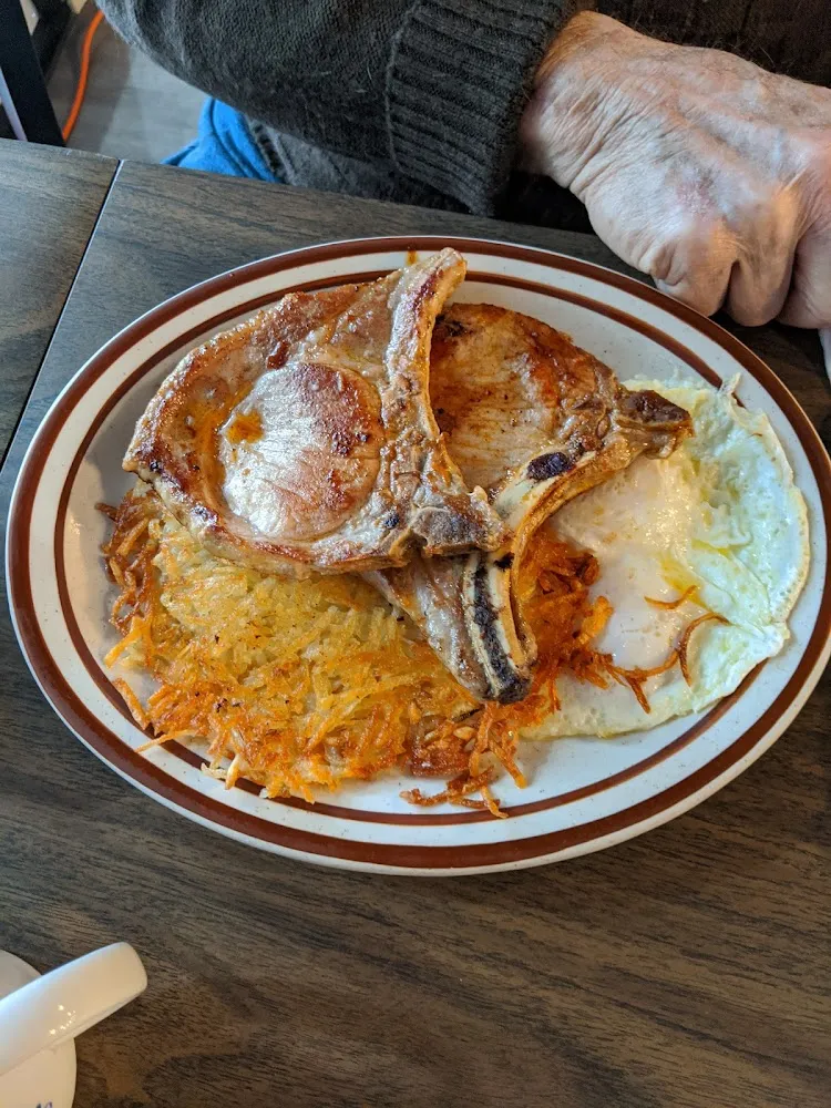 Three Eggs and Two Pork Chop Breakfast